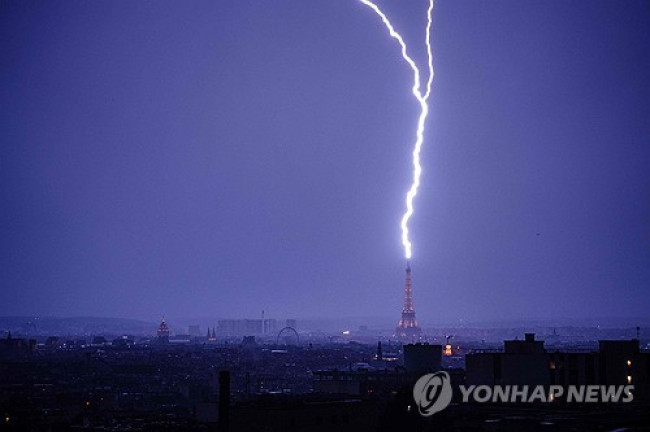 The Eiffel Tower struck by lightning on the night of the 27th