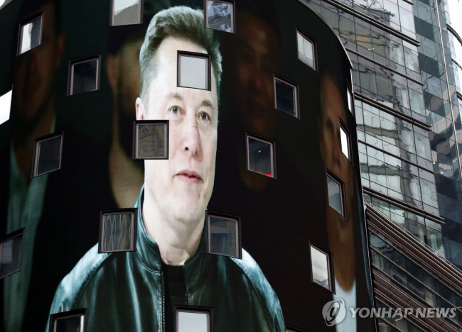Elon Musk on a Times Square billboard