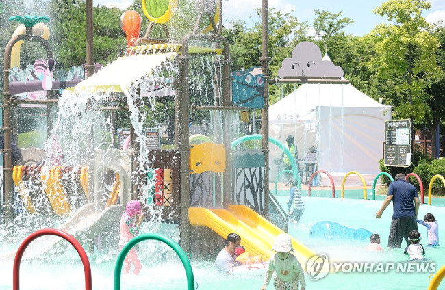 Citizens enjoying water play amidst a major heatwave warning in Gyeongsan