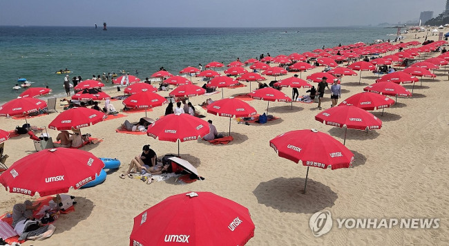 Parasols on the sandy beach waiting for vacationers